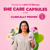 A woman in a beige top holds a bottle of She Care Capsules against a pink background with floral graphics and promotional text.